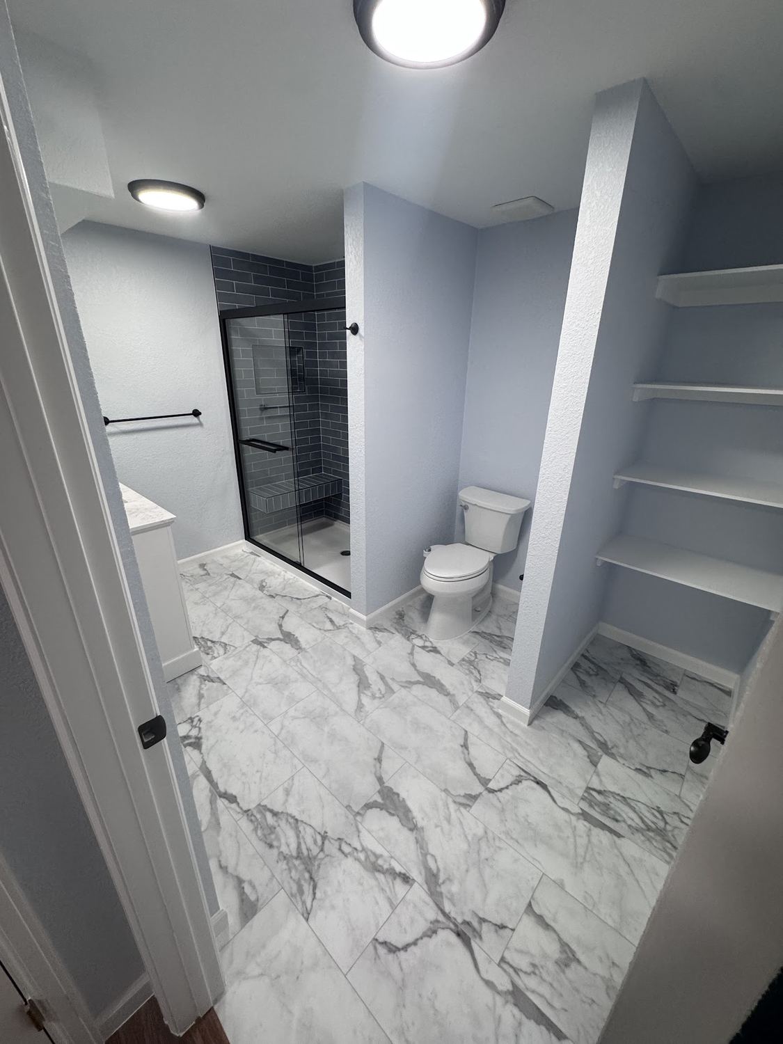 Marble tile bathroom remodel for a homeowner in Westminster, CO.